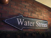 This handpainted sign is part of a set that adornes the wall of a converted old brick factory